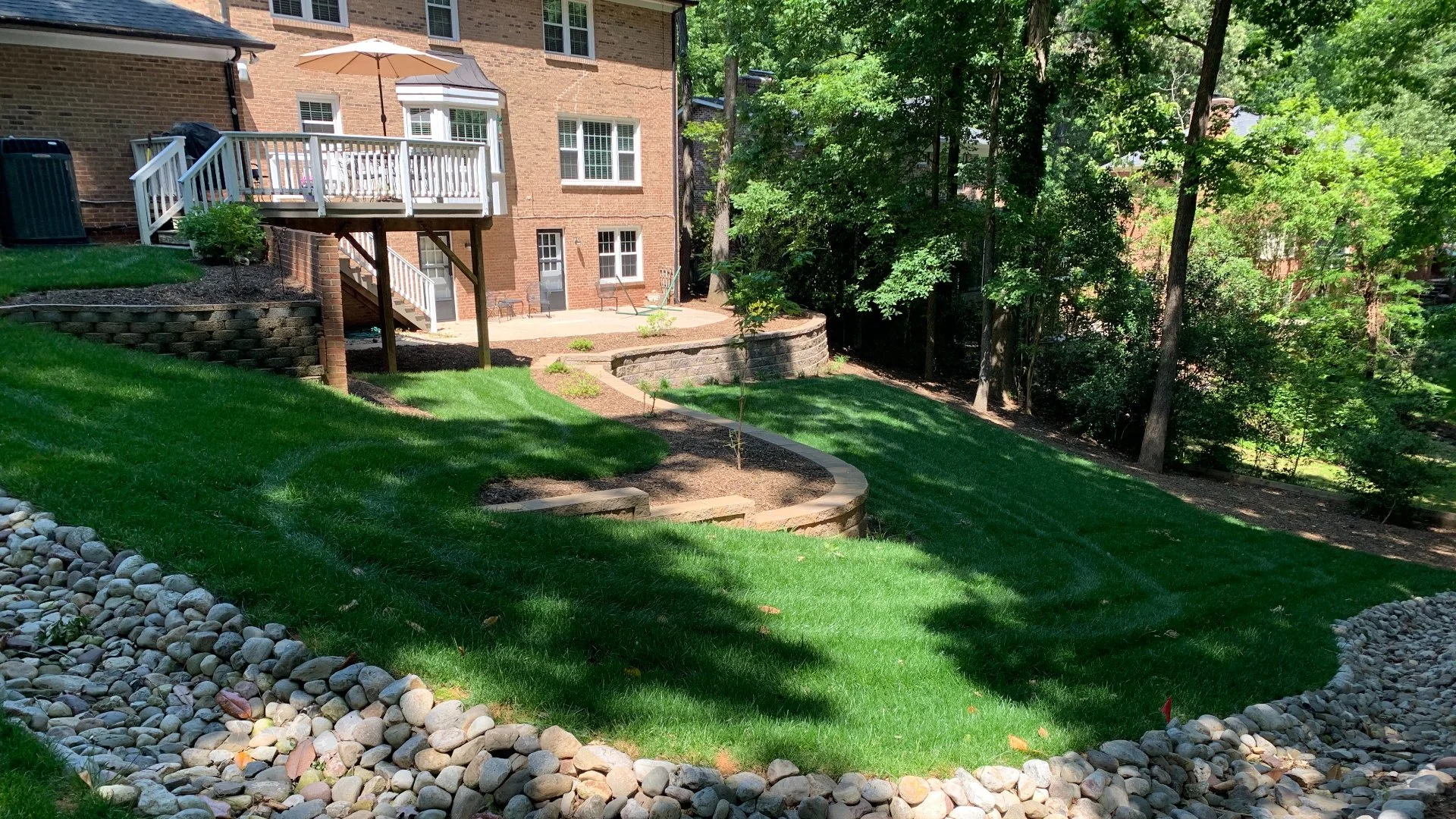 A beautiful house with a lush, green lawn in Monroe, NC.