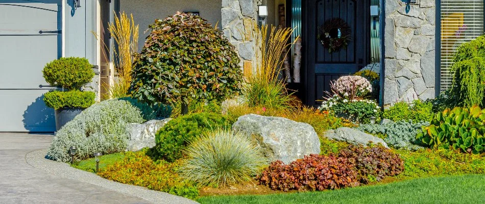 Front yard of a house in Cornelius, NC, with a beautiful landscape.